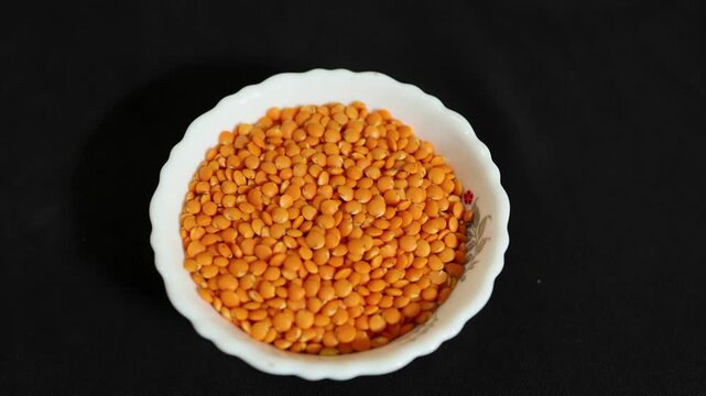 raw masoor dal in ceramic bowl showcasing nutritious plant based protein source