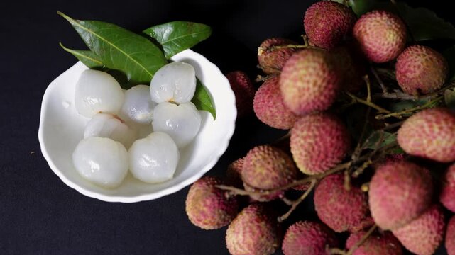 sweet lychee fruit still life with natural leaves and juicy white flesh