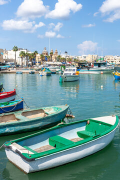 Marsaxlokk village harbor of Malta, Mediterranean traditional colorful boats luzzu.