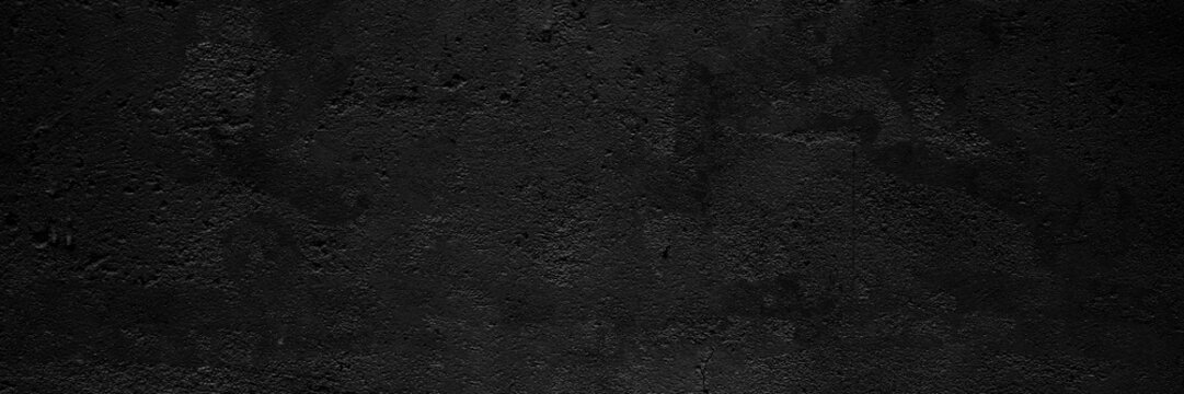 Black wall with cracks and dark shading, great for backgrounds in design projects needing a distressed look.