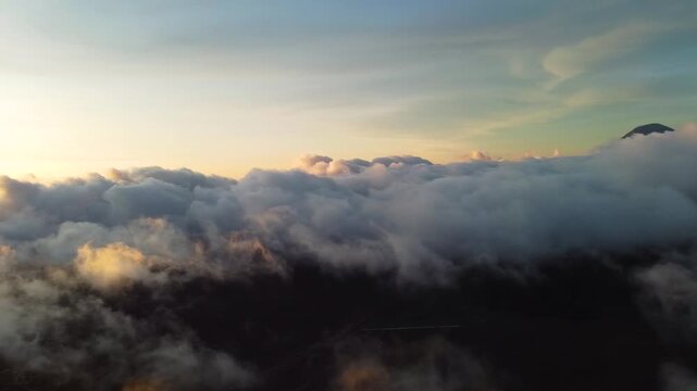 Scenic sunrise above clouds over bromo volcano in indonesia