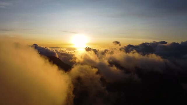 Golden sunrise aerial view over bromo volcano and clouds