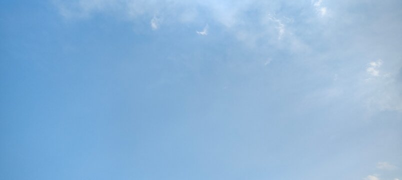 Vast Blue Sky with Wispy Cloud Trails, Dreamy Feel Natural Background 	