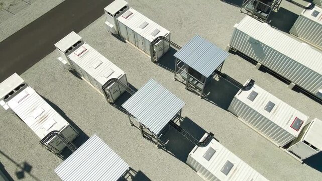 Industrial scale battery energy storage system plant with large container modules for storing renewable power, representing the future of sustainable green electricity and smart grid technology