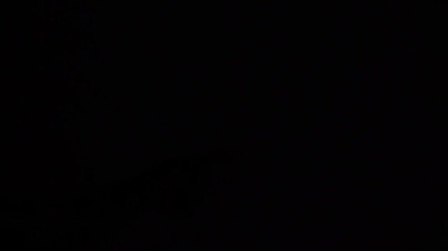 Wall light being switched off in dark room, perfect for electricity, home interior, energy saving, and illumination themes.