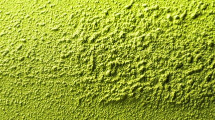 Fototapeta premium Bright lime green finely ground powder displays a pronounced, textured surface appearance.