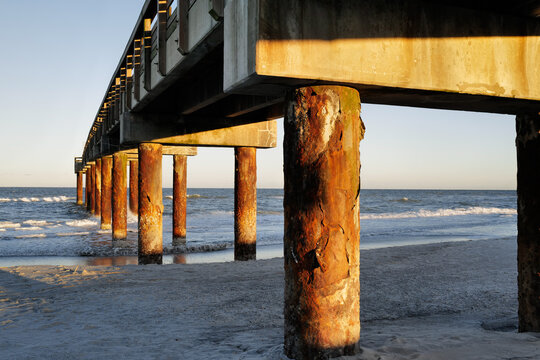 The wooden pier on St. Augustine Beach in Florida at Sunset