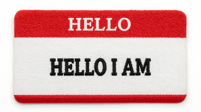 Embroidered red and white rectangular name tag with 'hello' and 'i am' text perfect for introductions events and icebreakers isolated on white background