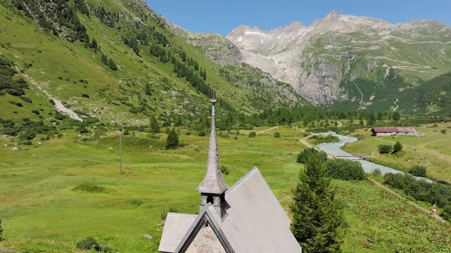 Historic Mountain Chapel Near Furka Pass Surrounded by Swiss Highlands