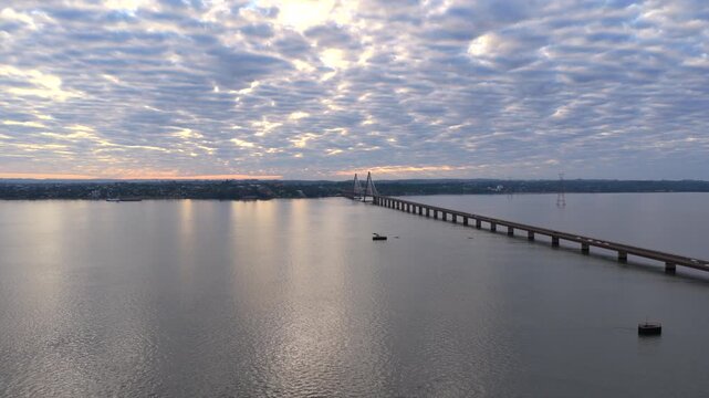 Aerial sunrise view of the San Roque Gonz&aacute;lez Bridge connecting Posadas Argentina and Encarnacion Paraguay.