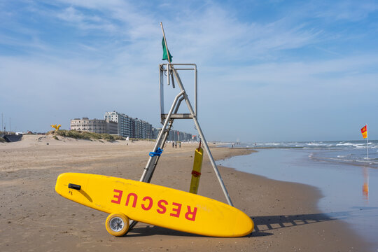 Yellow Rescue Board and Lifeguard Stand on Sandy Beach, Middelkerke, Belgium