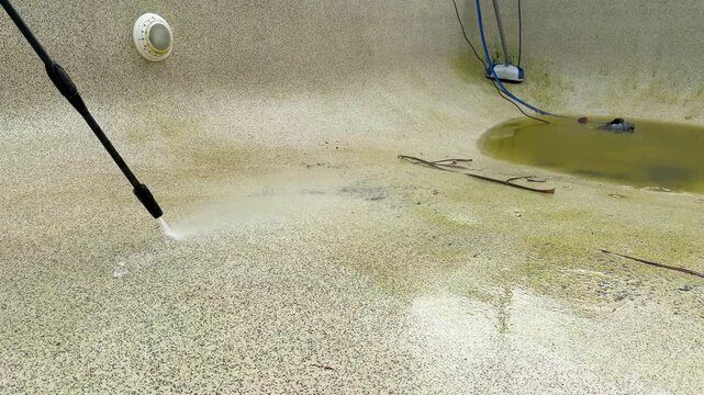 High Pressure Water Blast Cleaning Dirty Concrete Swimming Pool Surface