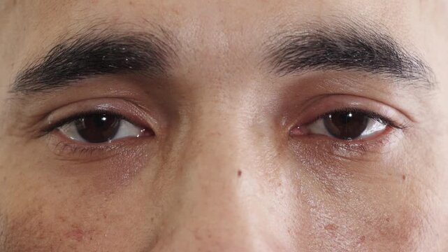 Eyes, face and vision with man at clinic for optometry appointment or checkup. Healthcare, optical and sight with medical patient at ophthalmology assessment for visual correction or improvement