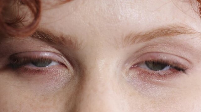 Optometry, face and eyes with screening, closeup and glaucoma test in vision examination. Portrait, blink or female person with optical function, eyesight care or visual tracking for ocular wellness.