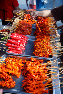 Traditional Filipino Street Food Skewers at Outdoor Market