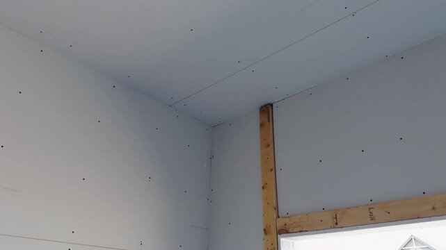 Close up view of Element of Unfinished interior room in a new residential house with drywall installation