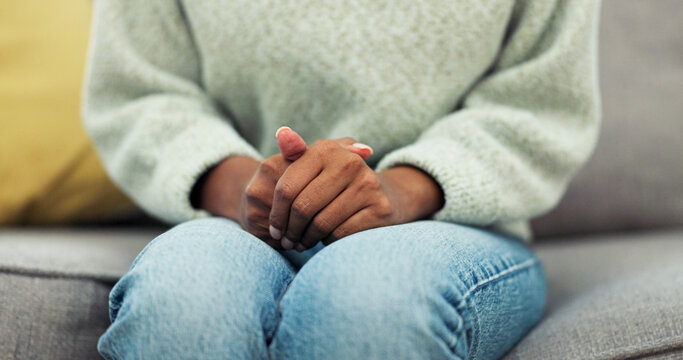 Nervous, hands or woman with anxiety at therapy for PTSD, pressure or panic for trauma processing. Counseling, mental health or patient with stress on sofa for worry, vulnerable or emotional tension