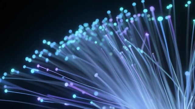 Glowing fiber optic cables radiate blue, purple, and cyan light, symbolizing high‑speed internet, modern communication, and advanced data transmission networks.
