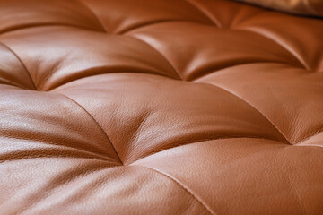 Naklejka premium Brown tufted leather upholstery texture, luxurious furniture material, elegant interior design detail, high-quality craftsmanship