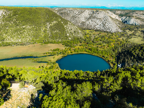 Aerial view of the confluence where the Cikola river lake drom torak view tributary joins the Krka river canyon, Krka National Park, Dalmatia, Croatia.