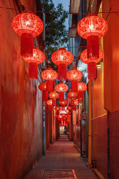 Narrow street decorated with traditional Chinese red lanterns