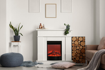 Obraz premium Modern living room interior with electric fireplace, cozy sofa, houseplants, and decorative elements for home comfort