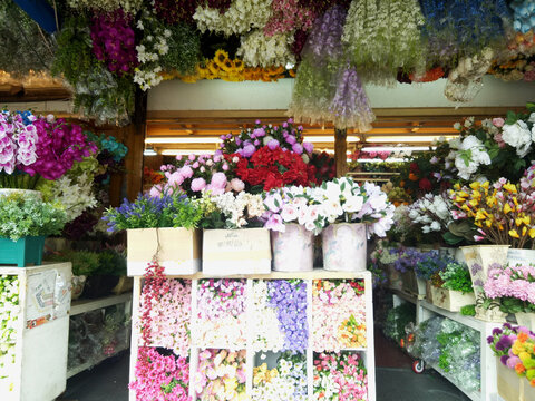 Display of Artificial Silk Floral Bouquets on Shelves