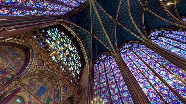 Magnificent interior view of the Sainte Chapelle in Paris, featuring the stunning stained glass windows, a masterpiece of Gothic architecture and a famous historical landmark in France