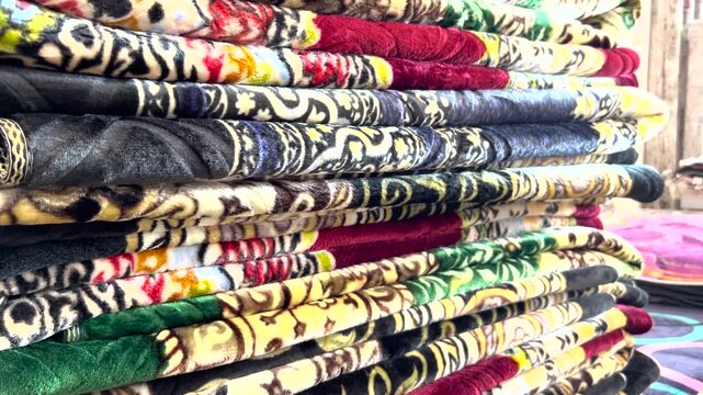 Multiple Persian carpets for sale at the store. Traditional hand-woven rugs with Vibrant colors.