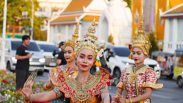 Traditional Thai Khon Manohra Dancers in Ornate Costumes at Wat Suthat