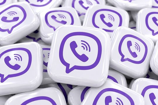  A pile of white and purple Viber logos on square shiny buttons, isolated on colorful background