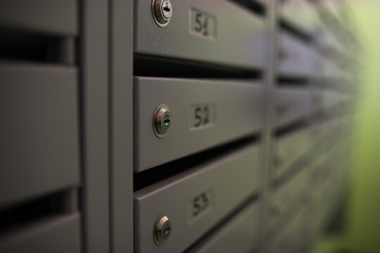 Close-Up of Modern Lockable Mailboxes in Residential Building for Secure Mail Delivery