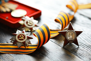 Naklejka premium Patriotic War Order and battle order for courage and bravery on George Ribbon background for the great day of Victory (russian text: Patriotic War)