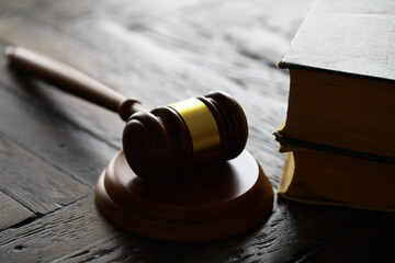 Obraz premium Judges gavel on wooden desk. Law firm concept.