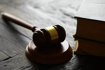 Judges gavel on wooden desk. Law firm concept. © alexkich