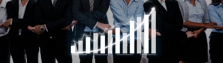 A diverse team of professionals stands shoulder to shoulder, showcasing collaboration alongside a rising financial graph, symbolizing success and growth in business. Axiom © InfiniteFlow