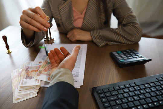 Businessman giving money, Russian Ruble currency, to hs partner - payment, loan and bribery concept