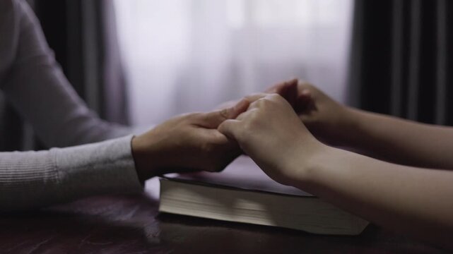 Christian group are praying to god with the bible and sharing the gospel. Concept of faith for god. Concept of faith for god.