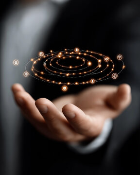 Celestial Orb in Hand: A close-up shot shows a man's open palm holding a miniature, glowing solar system model, symbolizing innovation and cosmic ideas.