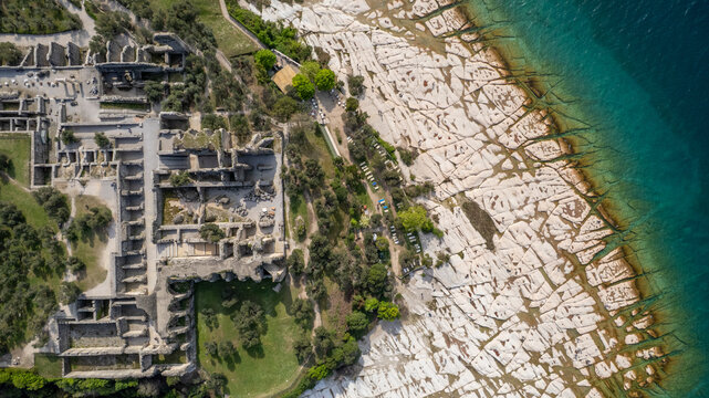 Aerial view over Archaeological site of Grotte di Catullo in Garda lake, Italy