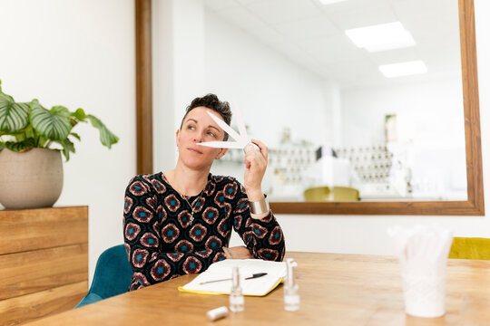A female perfumer tests new fragrance scent samples