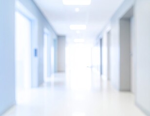 Fototapeta premium Defocused interior of a long corridor with bright light at the end