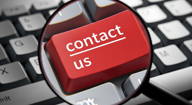 Magnifying glass over a keyboard key labeled 'contact us' symbolizing communication and connection magnifying keyboard communication connection