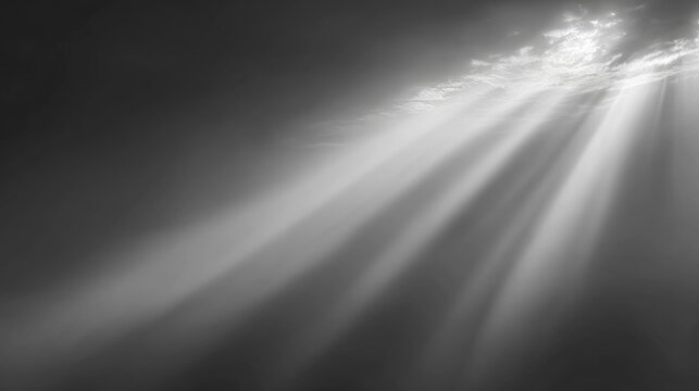 Heavenly light beams pierce through smoky clouds in a dramatic, ethereal display