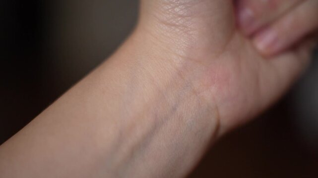 Close up of a female wrist skin with veins and skin texture