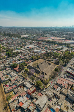 Aerial view over Tenayuca Archaeological Site, Mexico. Pyramid in the middle of the city