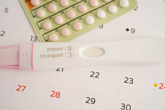 Pregnancy test with birth control pills for female of ovulation day, fetus, maternity, childbirth.