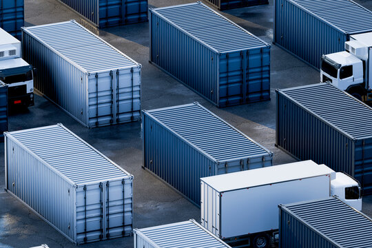 3D blue container yard with trucks navigating storage lanes