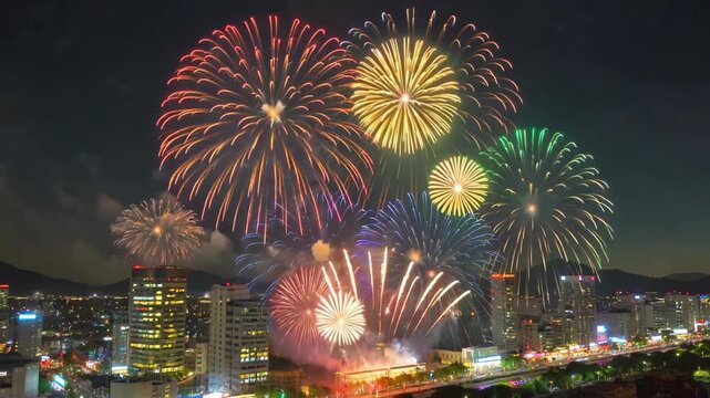 Colorful fireworks bloom in the city night sky, and brilliant fireworks bloom in the city night sky