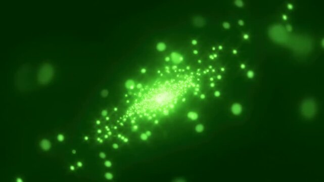 Glowing green particle burst on dark background